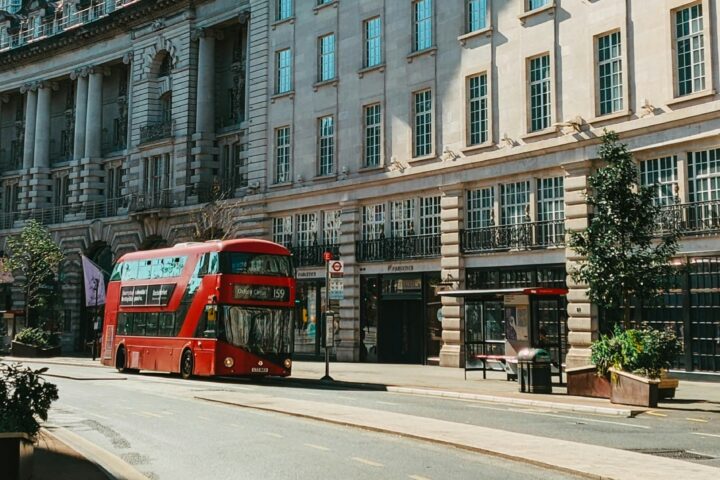 Red London bus parked in Mayfair, London